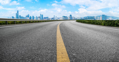 Road surface and urban architectural landscape skyline