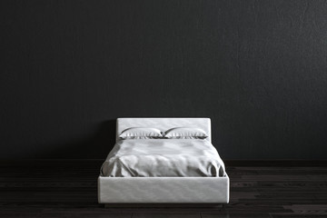 White bed in front of black wall.