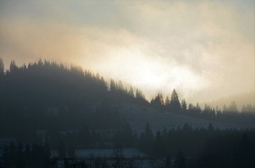 evening light with fog on the mountains