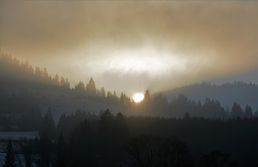 sunset after mountain with fog