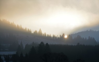 sunset after mountain with fog