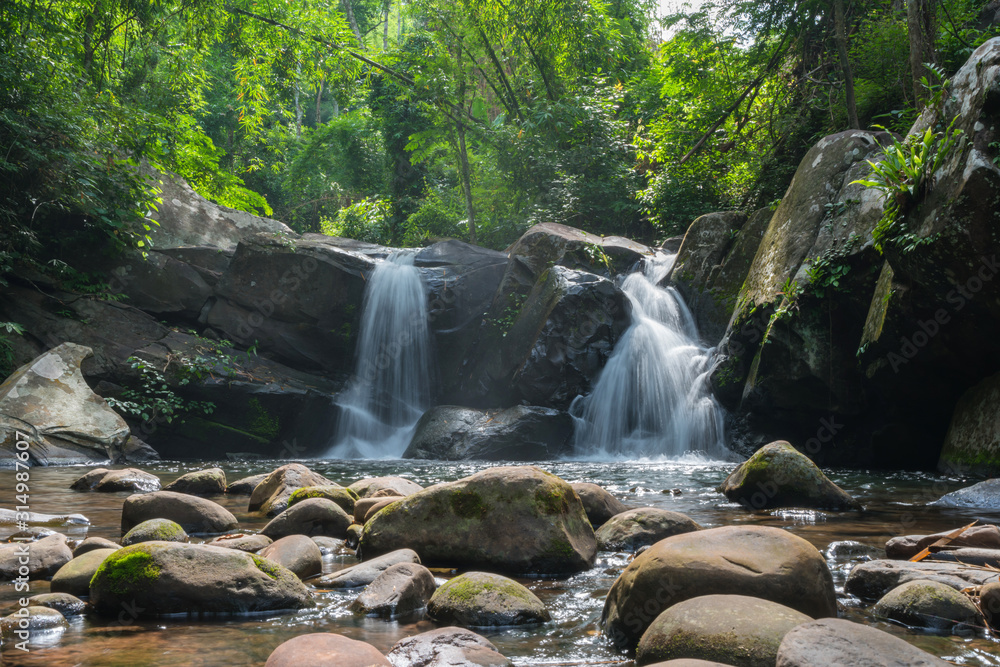 Wall mural waterfall scene at phu soi dao national park in uttaradit province thailand