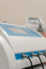 Closeup photo of multifunctional laser machine in beauty salon