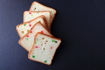 Slices of Pound dry fruit cake or bread. Indian Tutti Frutti bread, selective focus. with copy space