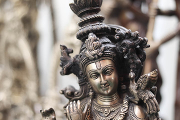 Obraz premium Close Up Of Indian Lord God Krishna Made Of Brass Metal