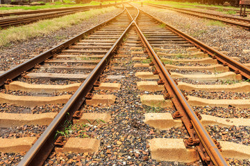 Close up low down view of railway train transport metal steel rails.