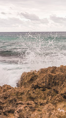 waves crashing on rocks