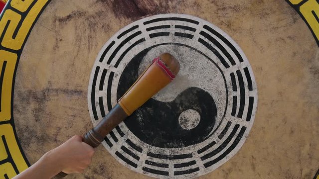 Hand playing traditional drum at china temple with 4K resolution. Asian style concept.