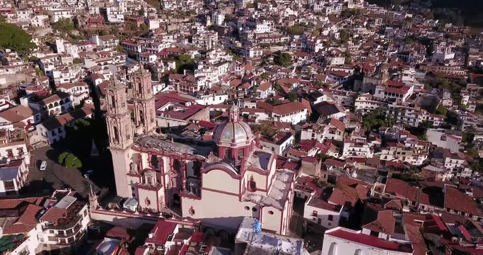 Taxco, Church of Santa Prisca in Mexico by drone on a sunny day.