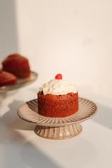 Stand with piece of delicious homemade raspberry cupcake
