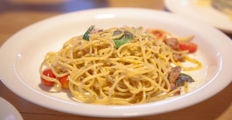 Italian Pasta Dish, Delicious Spaghetti Carbonara with ingredients of spaghetti, bacon, garlic, Parmesan cheese and eggs. Gastronomy, Culinary, Delicacy, Dinner, Cuisine, Food Menu and Recipe concept