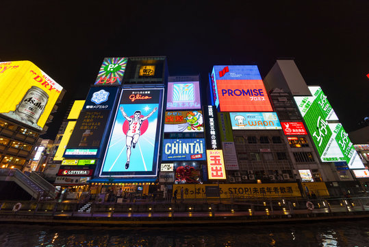Osaka, Japan - April 13, 2016 : The Glico Man advertising billboard and other advertisemant in Dontonbori, Namba area, Osaka, Japan. Namba is now primary tourist destination.