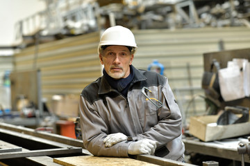 Portrait of steelworker working in plant