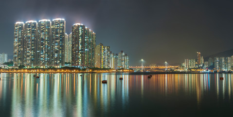 Fototapeta na wymiar Panorama of harbor of Hong Kong city at night