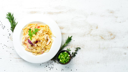 Pasta with chicken meat and cheese. Italian cuisine. Top view. Free space for your text.