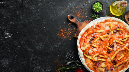 Pizza. Traditional pizza with sausages and french fries. Top view. Free space for your text.