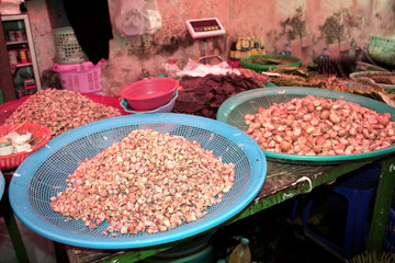 Selling chopped betel nuts on the market on market, Myanmar