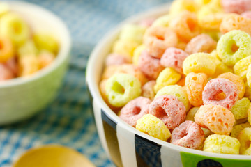 Cereal flakes in bowl with copy space,Breakfast concept.Food with delicious fruity taste and fruity colours.It's made with maize,wheat,and barley