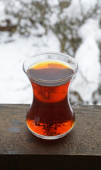 glass of hot Turkish tea in the garden