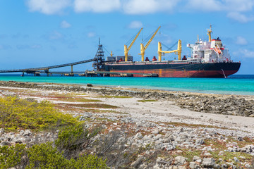 Loading salt into cargo ship on  coast