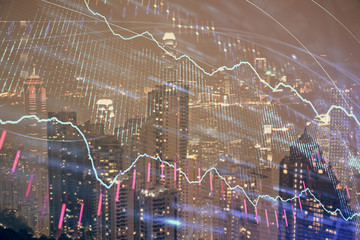 Double exposure of forex chart drawings over cityscape background. Concept of success.