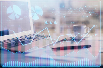 Forex graph hologram on table with computer background. Double exposure. Concept of financial markets.