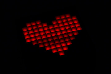 Heart closeup on a black background. Valentine's Day.