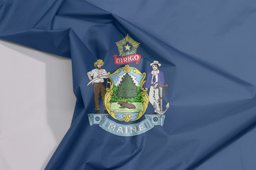 Maine fabric flag crepe and crease with white space. Maine coat of arms defacing blue field.