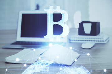Double exposure of blockchain theme hologram and table with computer background. Concept of bitcoin...
