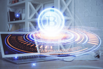 Double exposure of blockchain theme hologram and table with computer background. Concept of bitcoin crypto currency.