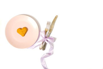 pink plate, heart shaped cookies, knife and fork isolated on white background, valentines day concept, flat lay