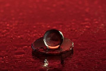 Glass ball of silica gel on a red blood-like surface