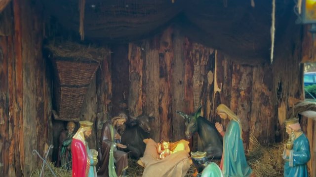 Christmas nativity scene represented with statuettes of Mary, Joseph, Jesus and magi