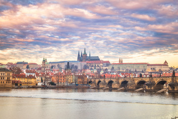 Fototapeta na wymiar Prague Castle and Charles bridge above Vltava river early morning with beautiful sky, Czech Republic, Europe.