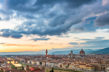Fototapeta na wymiar Amazing panoramic sunset view of Florence city, Italy with the river Arno, Ponte Vecchio, Palazzo Vecchio and Cathedral of Santa Maria del Fiore.