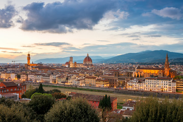 Fototapeta na wymiar Amazing panoramic sunset view of Florence city, Italy with the river Arno, Palazzo Vecchio, Cathedral of Santa Maria del Fiore and Basilica of Santa Croce.