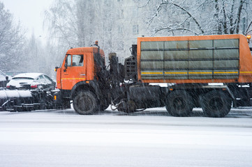 Truck spreading salt during blizzard