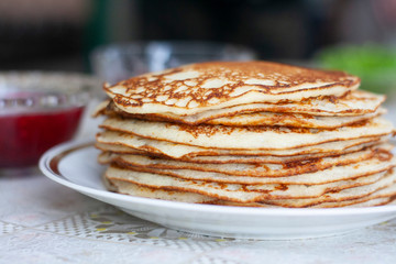 Traditional food, lots of pancakes in a plate