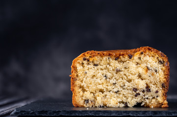 Fresh baked cupcake on dark background