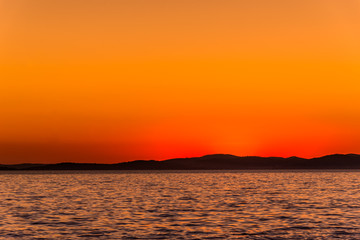 Orange sunset on sea horizon, landscape, Dalmatia, Croatia