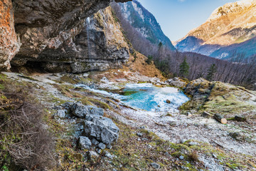 Fototapeta na wymiar Winter. Ice games in the Fontanon of Goriuda waterfall. Friuli, Italy.