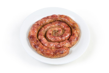 Baked homemade pork sausage curtailed by a spiral