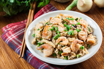 Fried rice with shrimp and vegetables served on a plate