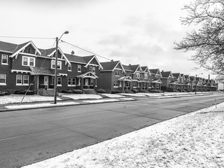 line of townhouses in winter snow