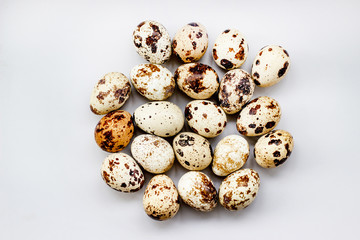 Obraz premium Quail eggs on a white background. View from above. Small Egg Isolate