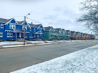 line of townhouses in winter snow