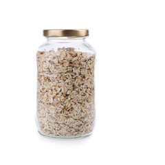 Oat flakes in a glass jar on a background new.
