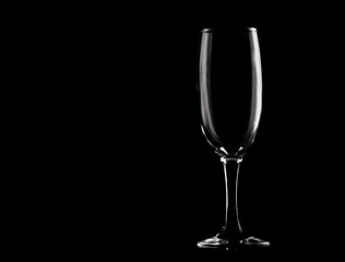 Empty wine glass on black background with copy space