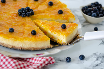 The cheesecake with orange and blueberries