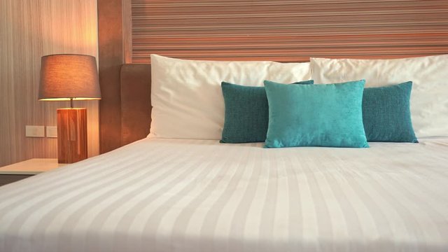 Pan across a resort hotel bed.
